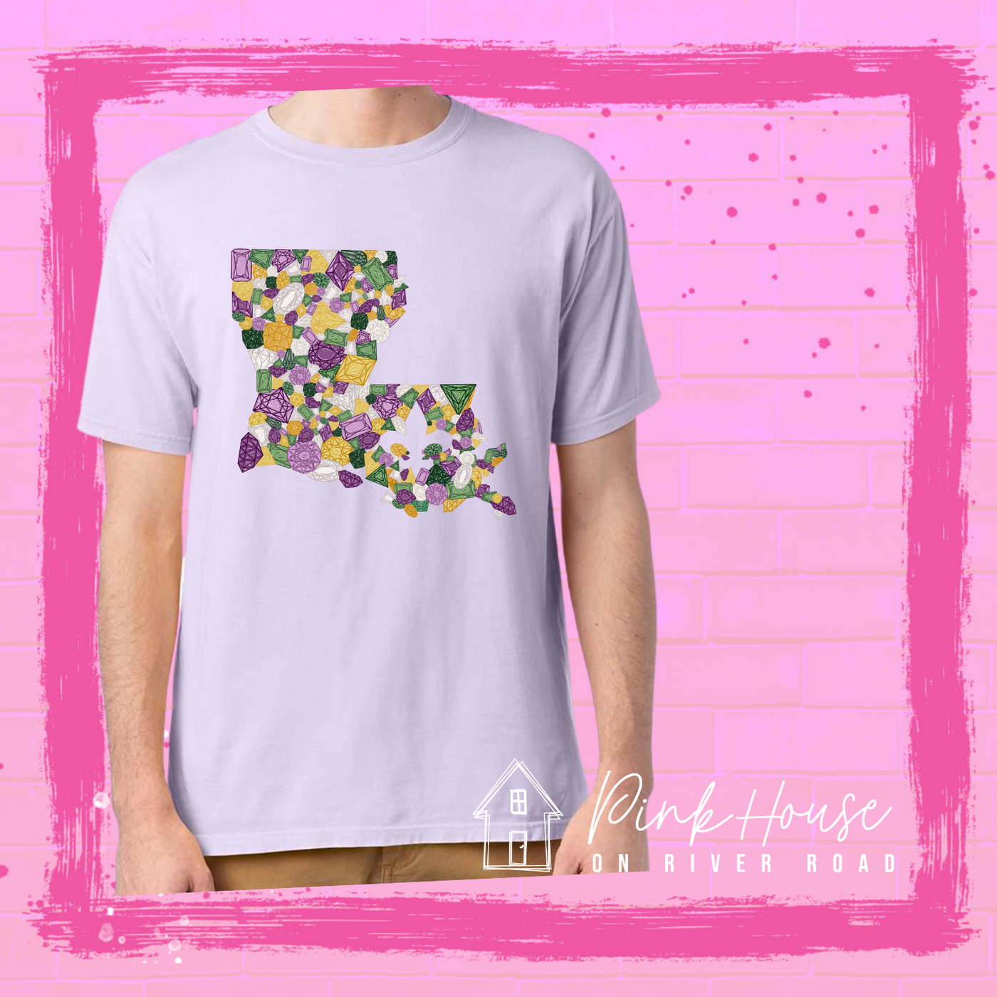 Lavender tee with a graphic of the state of Louisiana compromised of different shapes and sizes of purple, green, yellow and clear jewels.