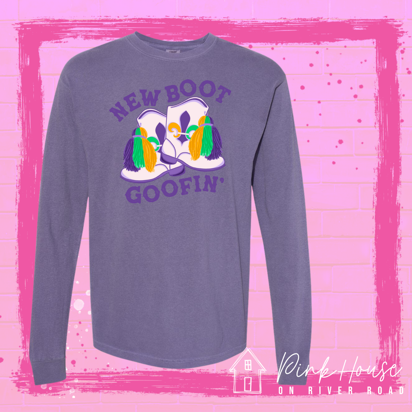 A purple long sleeve tee with a graphic. Graphic is of a pair of majorette boots, the boots have a tassel and fleur de lis both in gold, green and purple. the words New Boot are above the boots and the word goofin' is below thee boots the words are in purple.