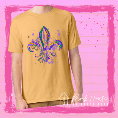 Mustard tee with a Fleur de Lis made up of layered green, yellow, and purple with green, yellow and purple colored splatters.