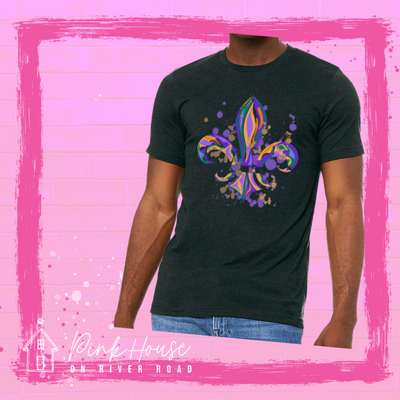 Black tee with a Fleur de Lis made up of layered green, yellow, and purple with green, yellow and purple colored splatters.