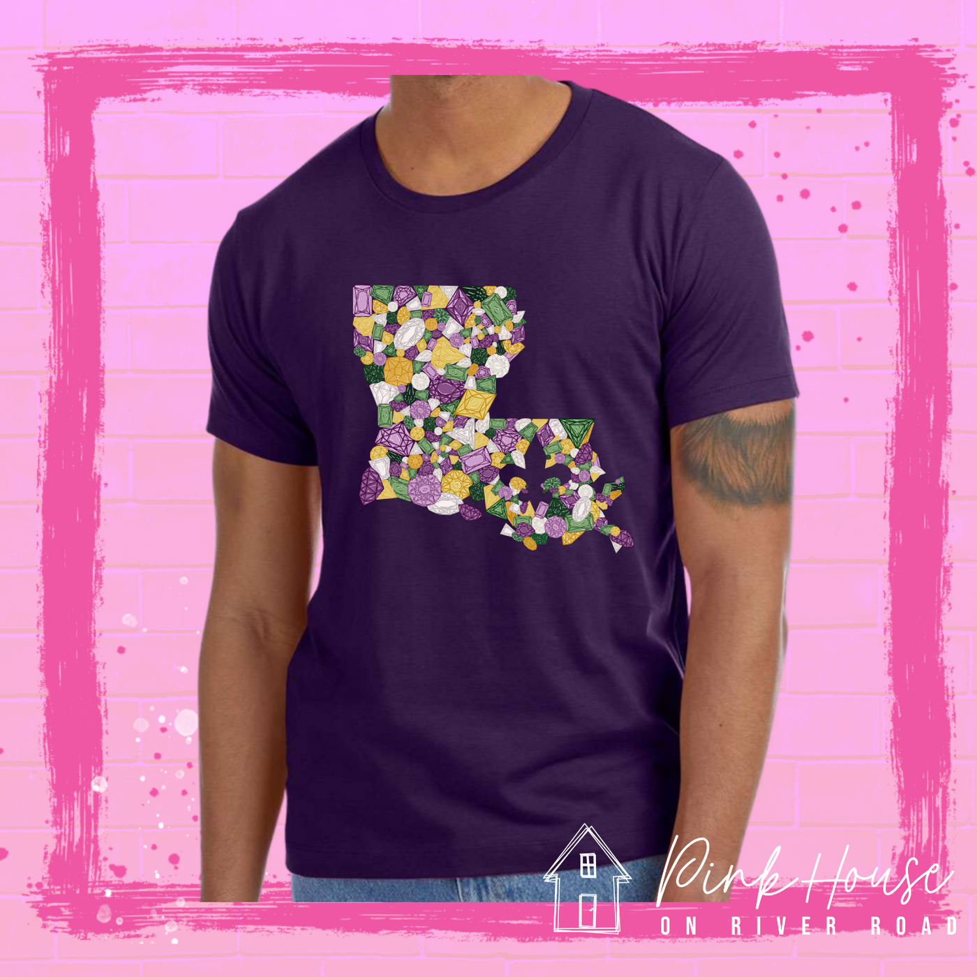 Dark Purple tee with a graphic of the state of Louisiana compromised of different shapes and sizes of purple, green, yellow and clear jewels.