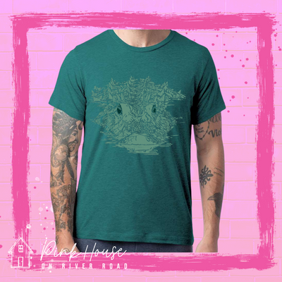 Dark teal tee with teal graphic of an alligator swimming through water.