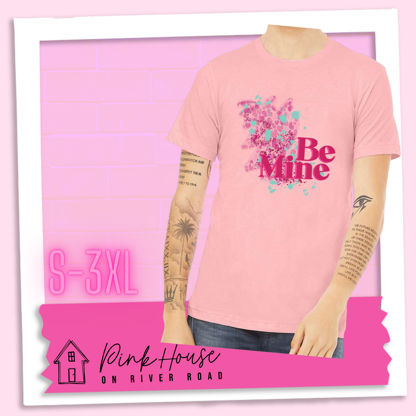  Pink Jersey Tee with a squiggle design made of pink hearts and pink sparkles with light teal splatters and pink text at the end of the art that says Be Mine with a hot pink shadow.