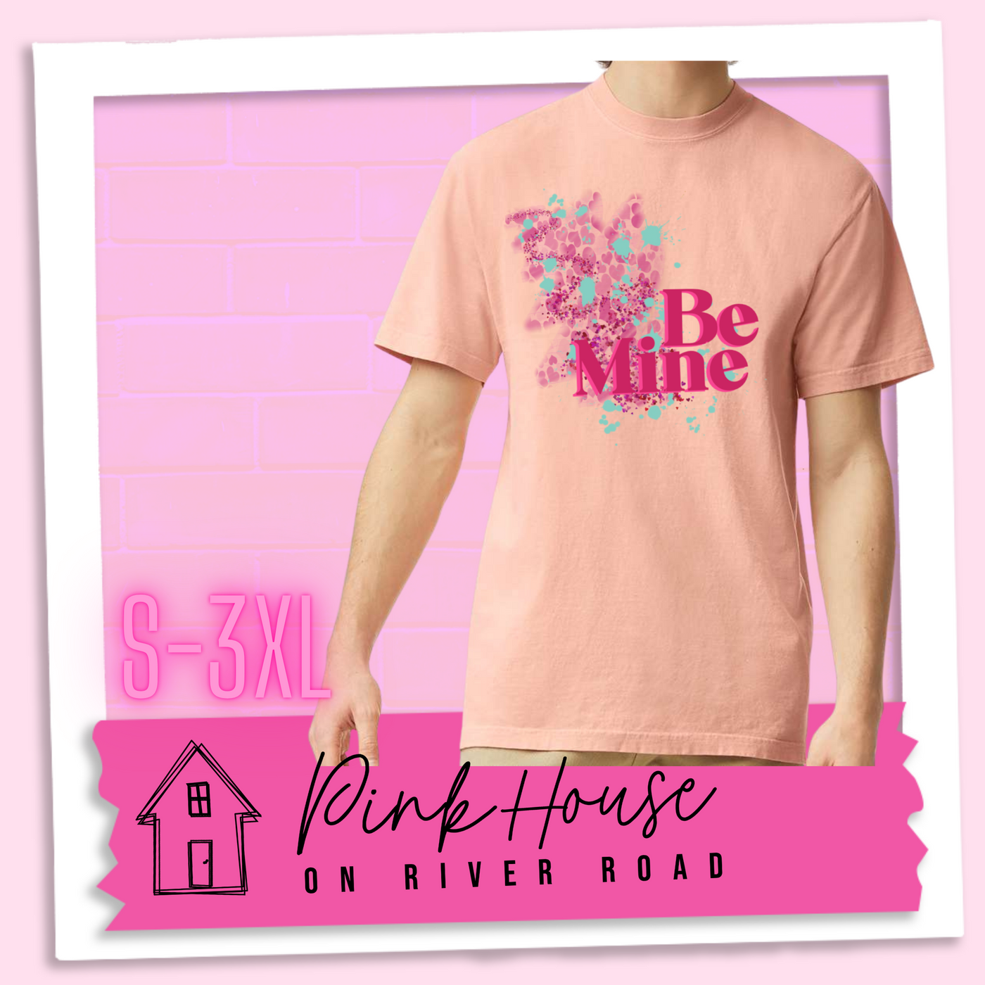 Peachy  Tee with a squiggle design made of pink hearts and pink sparkles with light teal splatters and pink text at the end of the art that says Be Mine with a hot pink shadow.