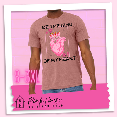 Heather Mauve Tee with a graphic that says "Be The King Of My Heart" in Black writing with a vintage effect. There is a King PLaying card with a speckled background, geometric hearts in the corners with the K and a realistic heart with a crown on it in the middle of the playing card.
