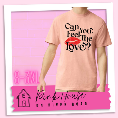 Peach Tee that says "Can you feel the love?" with a pair of red lips