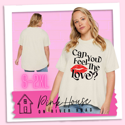 Blonde model in a cream oversized HiLo Shirt that says "Can you feel the love?" with a pair of red lips