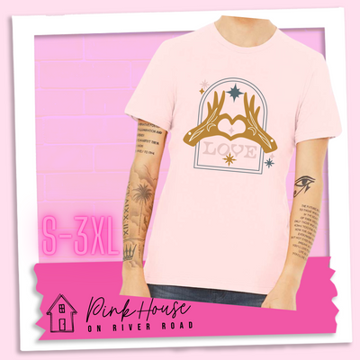 Soft Pink Jersey tee with a graphic. Graphic is of two tattooed hands making a heart in front of an archway with stars and the word Love in the archway.