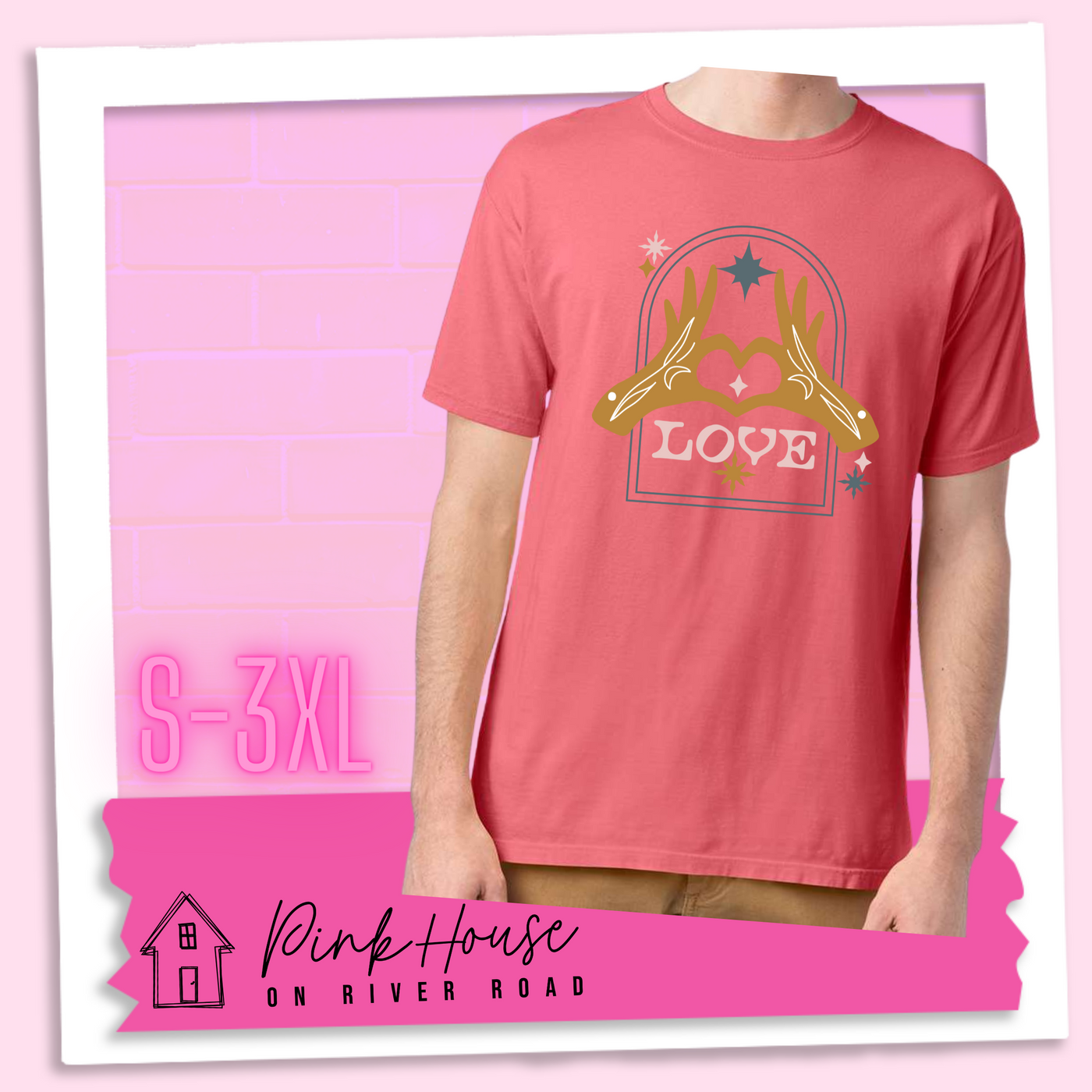 Coral tee with a graphic. Graphic is of two tattooed hands making a heart in front of an archway with stars and the word Love in the archway.