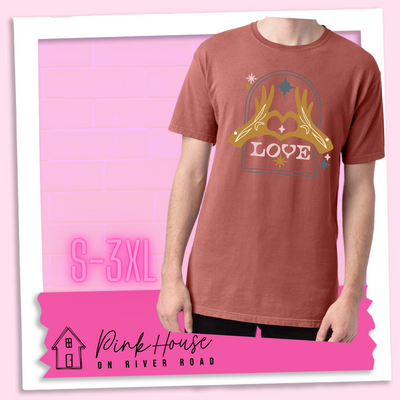 Nantucket red tee with a graphic. Graphic is of two tattooed hands making a heart in front of an archway with stars and the word Love in the archway.