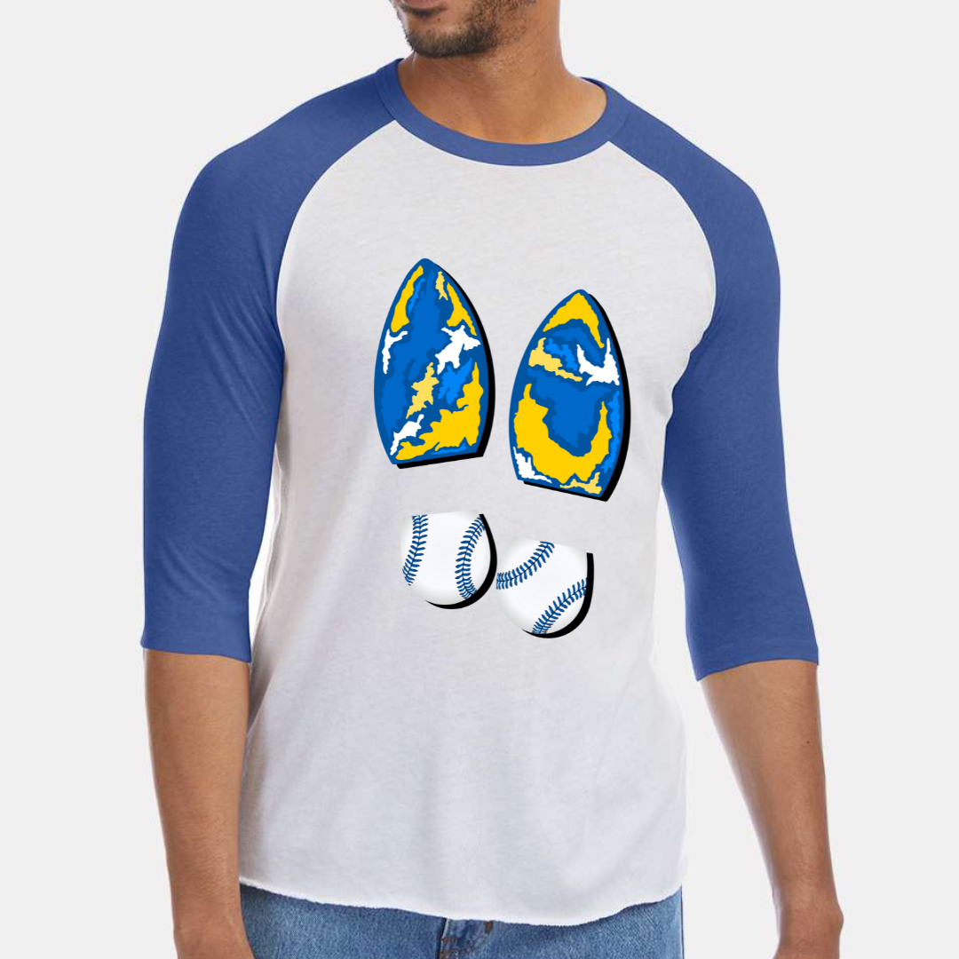 Royal Blue & White Raglan. Graphic is a pair of boot prints, The heel is a baseball print with blue stitching the sole is a abstract Royal, white, and yellow print. 