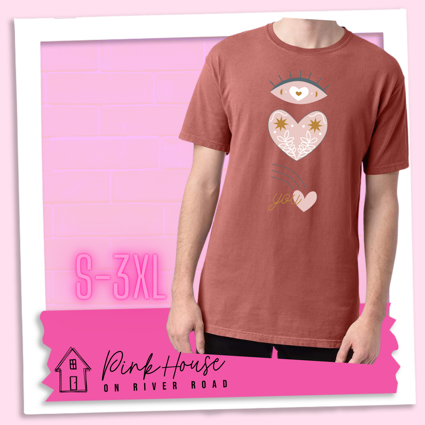 Nantucket Red tee with a graphic of an eye with a heart for the pupil and underneath that a heart with a floral and star design and a shooting heart with the word you. The graphic represents eye heart you