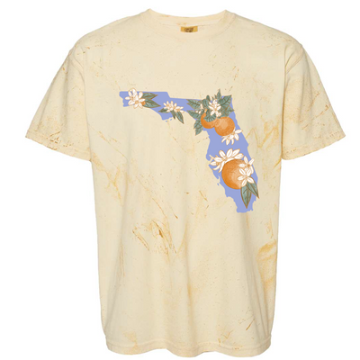 A citrine colorblast tee with a graphic. the graphic is the state of florida in light blue with oranges and orange blossom flowers on it.