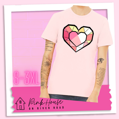 Soft Pink graphic tee. the graphic is of a geometric heart, it has black outlines to make it look like a gem with different shades of pinks, yellows, and white.