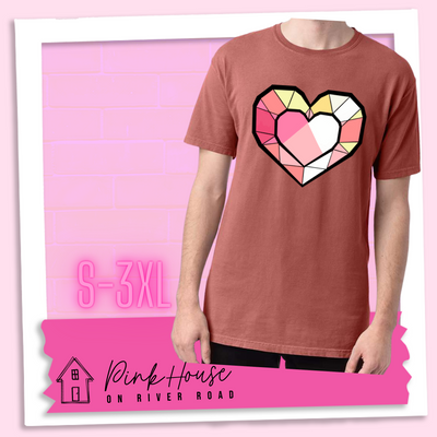 Nantucket red graphic tee. the graphic is of a geometric heart, it has black outlines to make it look like a gem with different shades of pinks, yellows, and white.