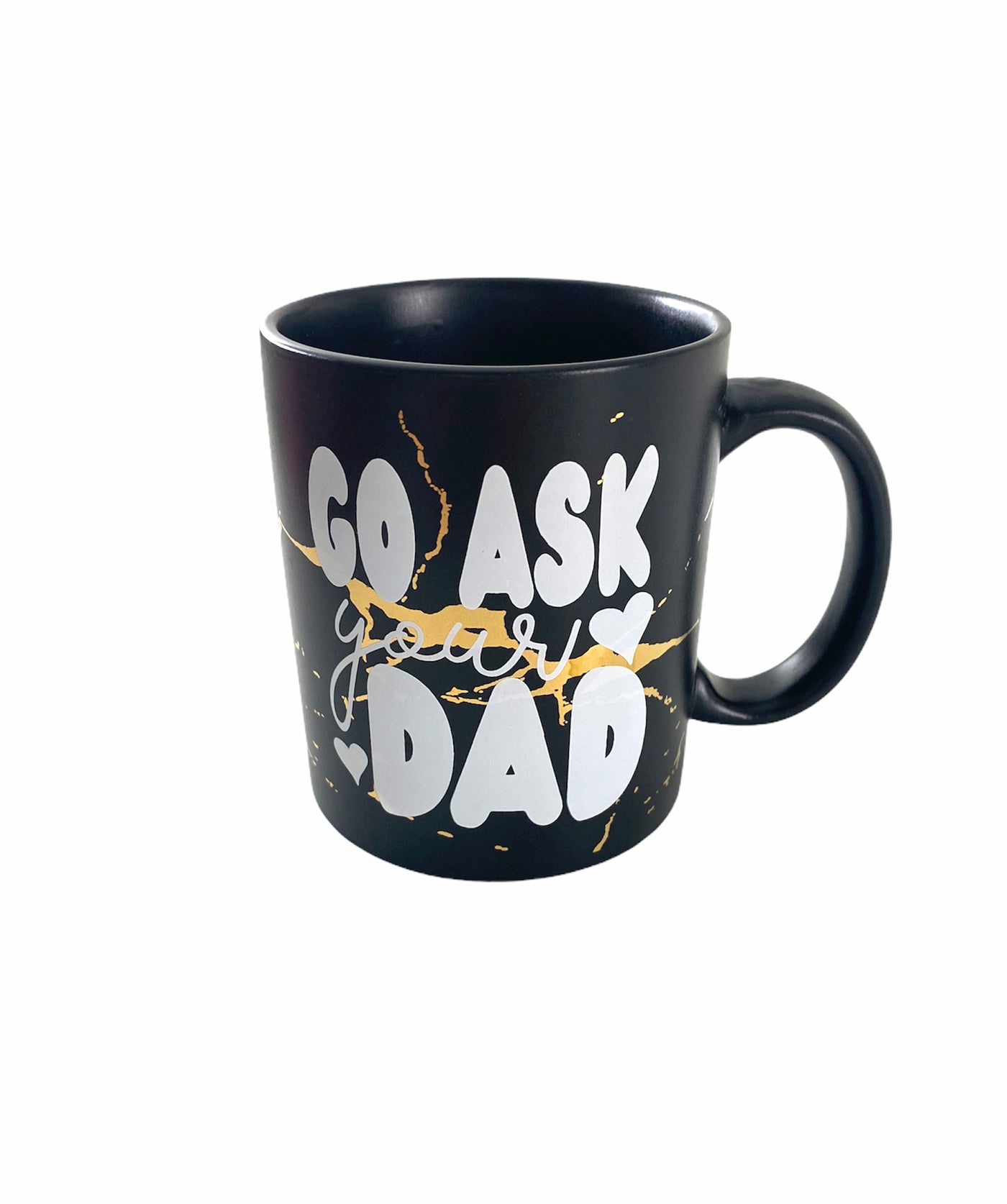A black coffee mug with gold veins. On the coffee mug there are the words "Go Ask" in bubble letter then the word "your" in cursive under that and on the bottom says "dad" in bubble font.