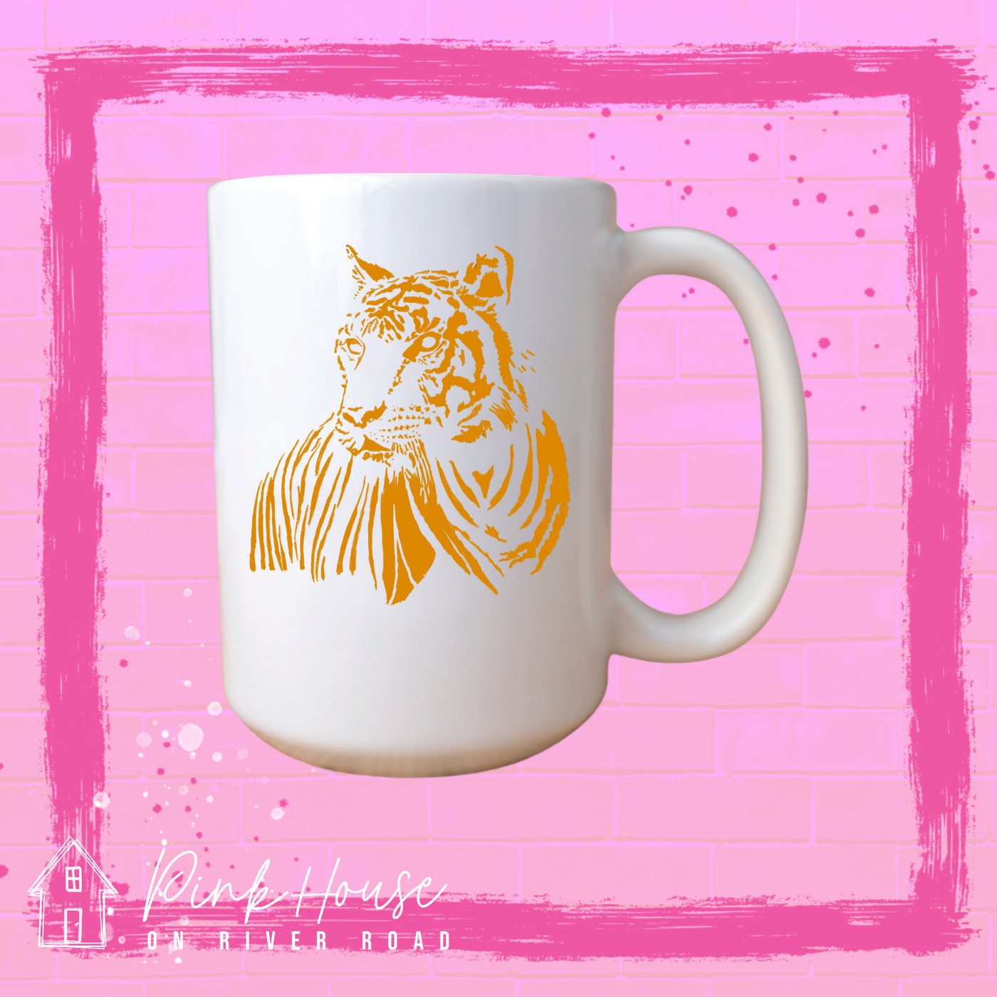 A white coffee mug with a gold tiger on it. 