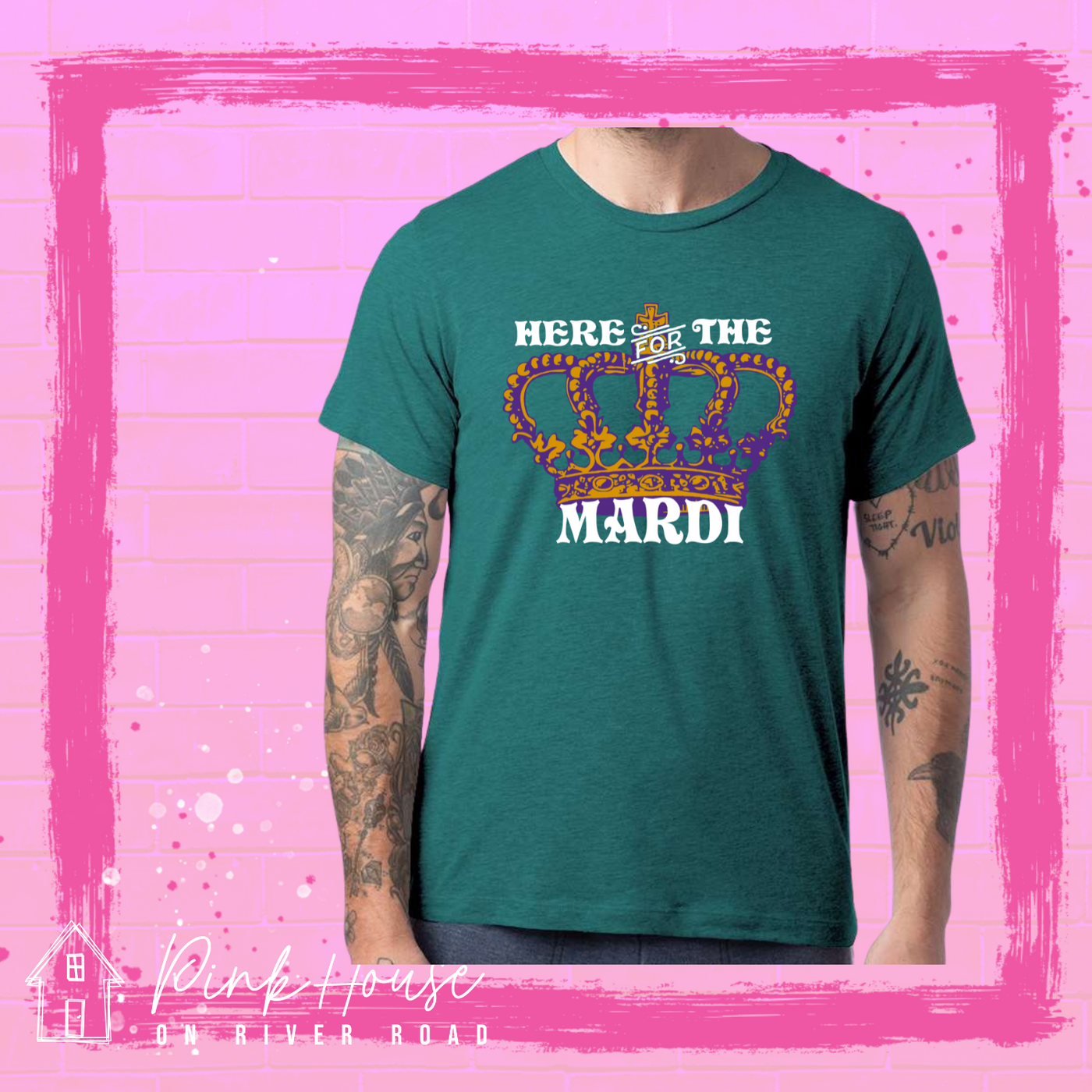 Dark Teal Graphic tee. Graphic is of an ornate Crown in purple and gold. Above the crown reads "Here for the" and under the crown reads "Mardi"