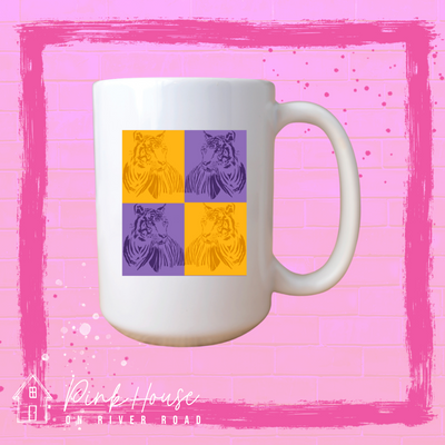 A white coffee mug with a pop art graphic. The graphic has a square compromised of four smaller squares.  The top left is a yellow square with a yellow tiger and the top right is a purple square with a purple tiger, on the bottom left is a purple square with a purple tiger and on the bottom right there is a yellow square with a yellow tiger