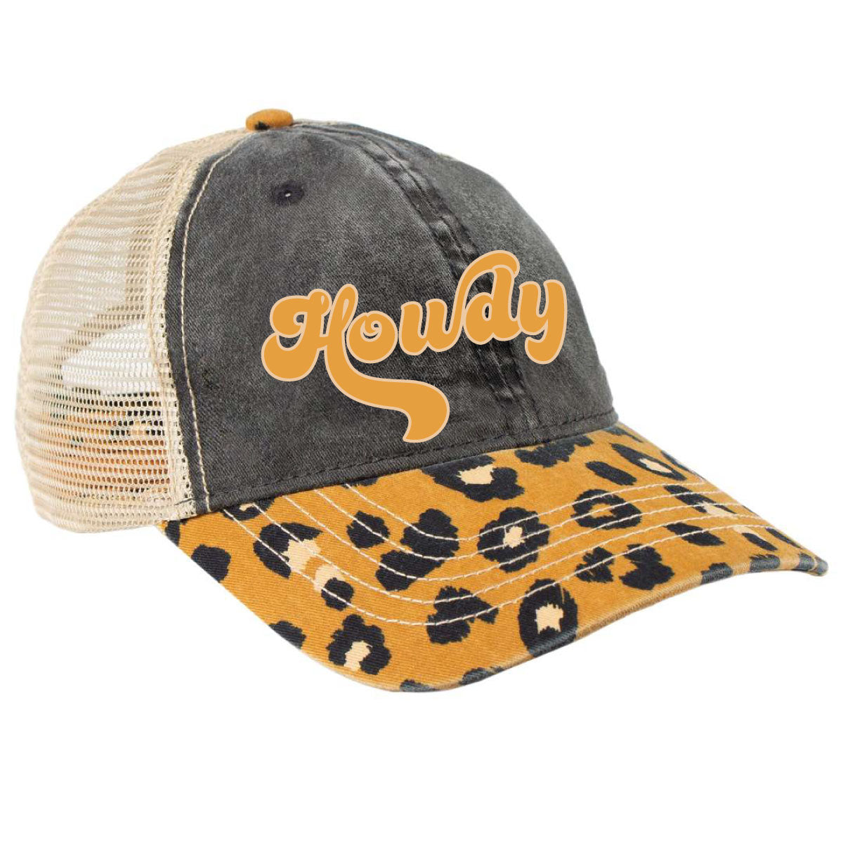 A mesh trucker hat with a cream mesh back, black stonewash front and a leopard print bill and the word howdy in a yellow retro font. 