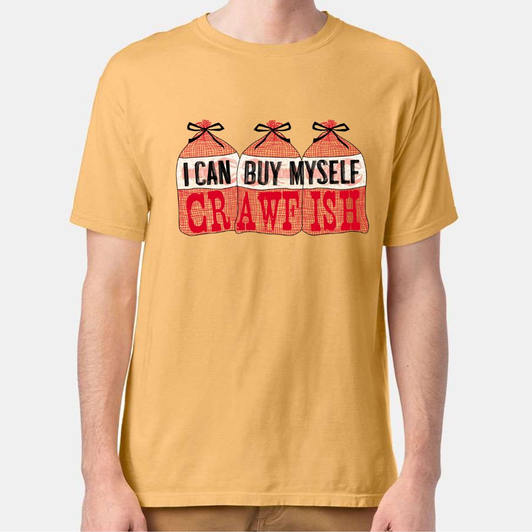 Heather Mustard Tee. Graphic is 3 bags of crawfish lined up next to each other. The labels read "I Can Buy Myself" and the word "Crawfish" In red on the bags under the labels