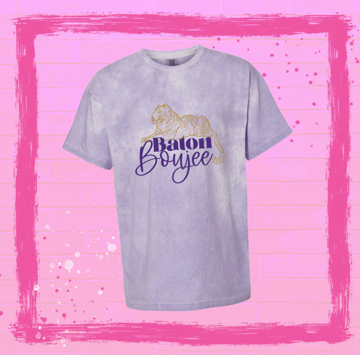 Purple tie dye shirt. Graphic of a line drawing tiger in gold with the words Baton Boujee underneath in purple with Boujee in cursive.