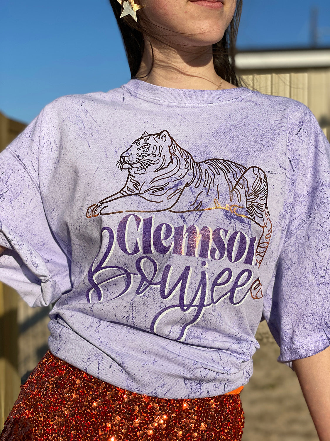 Purple Tie Dye Shirt with a gold foil tiger and the words Clemson Boujee in purple with a white shadow under the tiger.