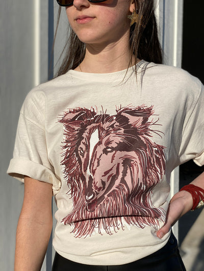 White shirt with a graphic of a red and maroon layered collie