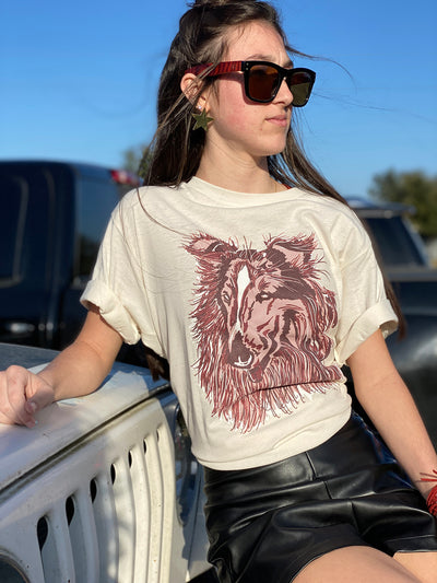 White shirt with a graphic of a red and maroon layered collie 