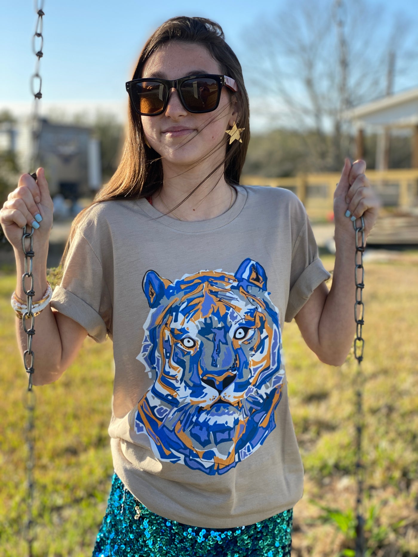 Natural tan tee with a white, orange and blue layered tiger graphic
