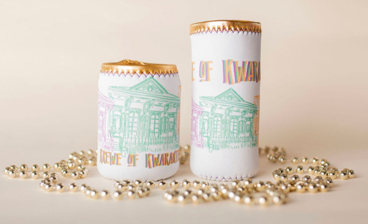 A white koozie with sketches of purple, green, and yellow historical houses and the words Krewe of Kwaranteen and a gold border on the top