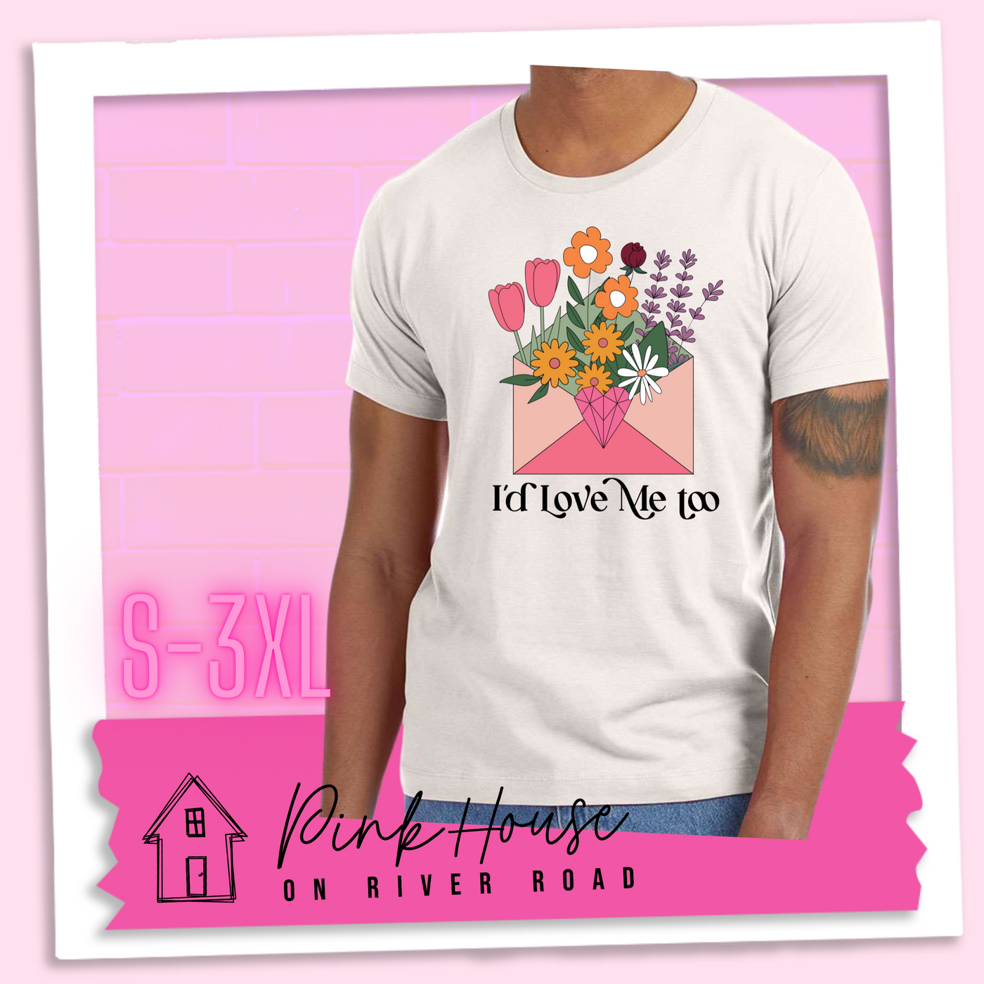 Dust tee with a graphic of a pink envelope filled with different types of flowers and a geometric heart seal. The text underneath reads "I'd Love Me Too"