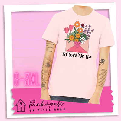 Soft Pink tee with a graphic of a pink envelope filled with different types of flowers and a geometric heart seal. The text underneath reads "I'd Love Me Too"