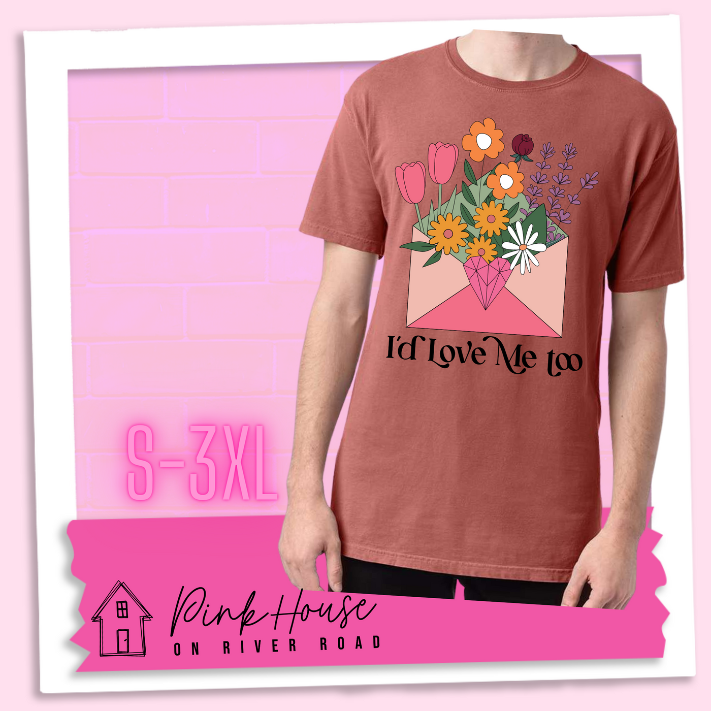 Nantucket Red tee with a graphic of a pink envelope filled with different types of flowers and a geometric heart seal. The text underneath reads "I'd Love Me Too"