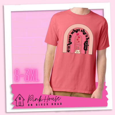 Coral tee with a graphic of a strawberry dessert and a set of lips with hearts, there is a pink arch going over the art. There is a retro font arched over the pink art that says "I'll have what she's having..." in black with another arch above that in light pink.