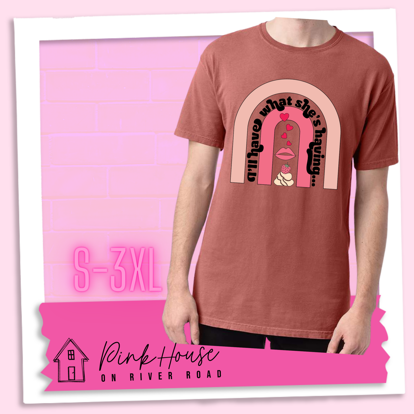 Nantucket Red tee with a graphic of a strawberry dessert and a set of lips with hearts, there is a pink arch going over the art. There is a retro font arched over the pink art that says "I'll have what she's having..." in black with another arch above that in light pink.