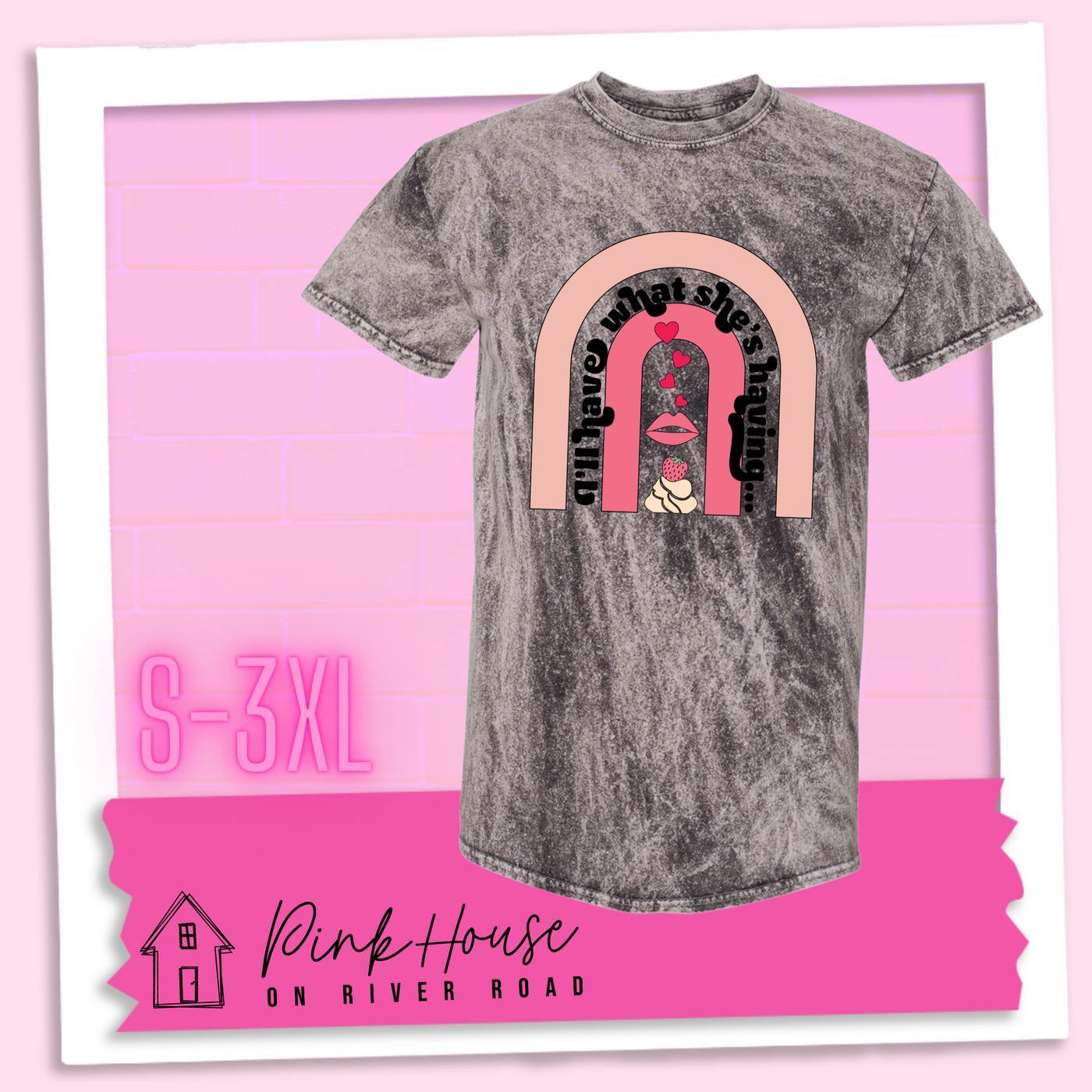 Charcoal Mineral Wash tee with a graphic of a strawberry dessert and a set of lips with hearts, there is a pink arch going over the art. There is a retro font arched over the pink art that says "I'll have what she's having..." in black with another arch above that in light pink.