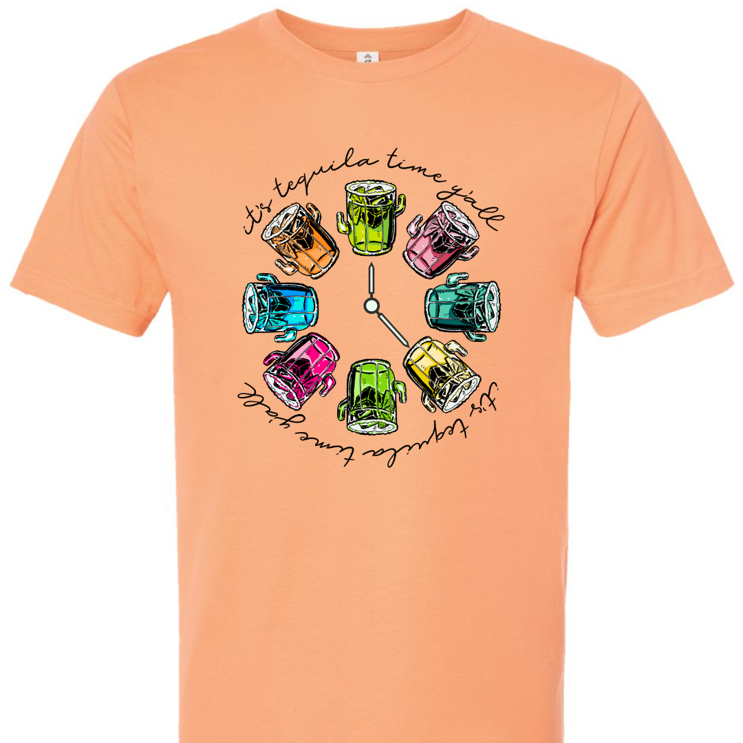 Cantaloupe tee with a graphic. Graphic has a clock in the center with multicolored margaritas instead of numbers and around the outside of the clock are the words "It's tequila time y'all" in black cursive font.