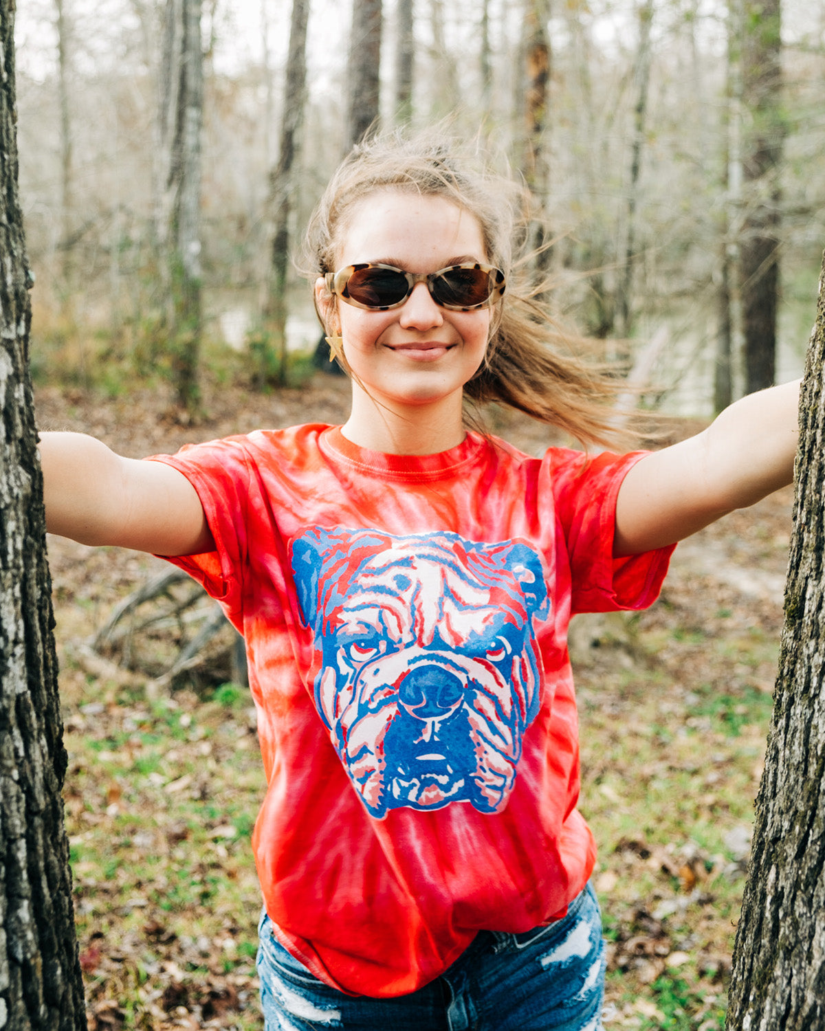Red tie dye tee with a graphic of a blue and white layered bulldog