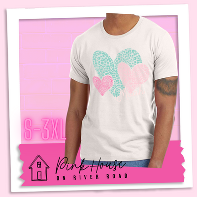 Dust tee with 3 different colored leopard print hearts in various sizes in the lower right hand corner of the graphic is the word Muah in light punk script