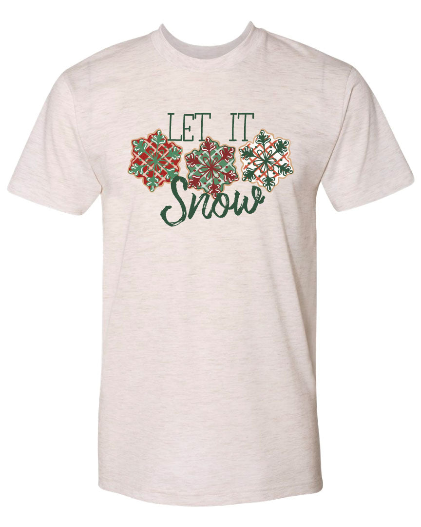 Oatmeal tee with the words Let It in think block letters at the top with three snowflakes underneath. Far left snowflake is red with beige stripes and a green snowflake design on the top, Middle snowflake is green with white stripes and a dark red snowflake design on the top, and the right snowflake is white with red stripes and a dark green snow flake design on top and the word snow in a brush script underneath.