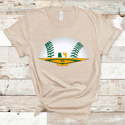Heather Tan Tee. Graphic is a green and yellow baseball field The horizon is a baseball with green laces and there is a baseball symbol in yellow and green with a lion in the middle near center field.
