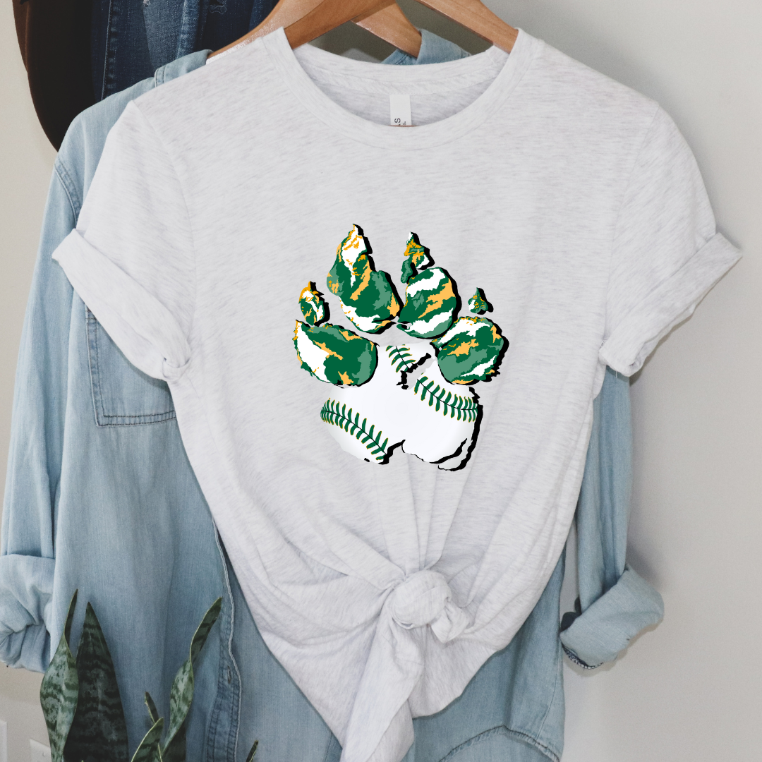 Ash Tee. Graphic of a paw print, the pad of the paw is baseball print with green laces and the toe pads are abstract green, yellow, and white print.