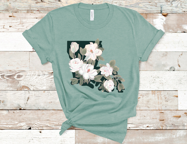 Heather Dusty Blue Tee. The state of Louisiana covered in white magnolia flowers