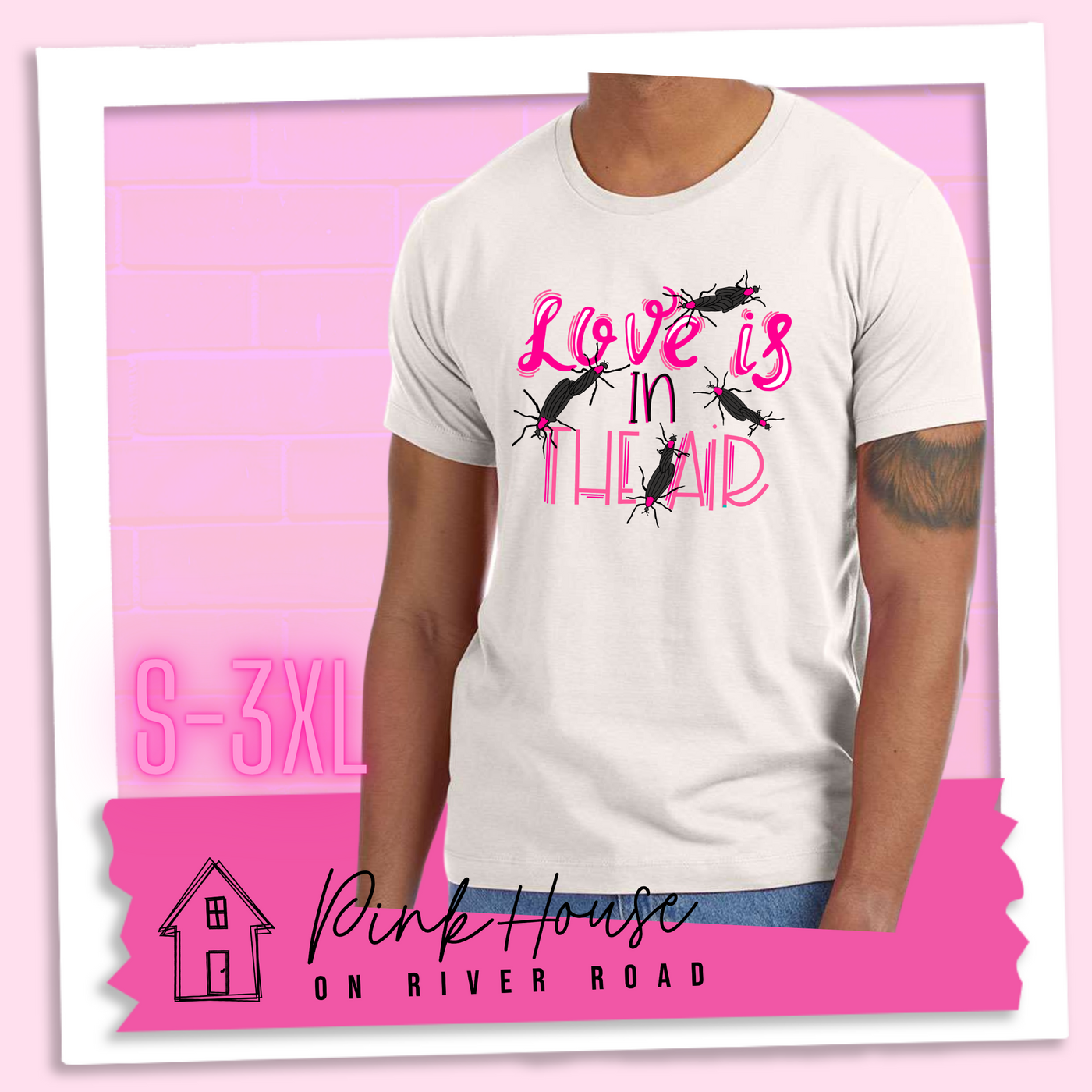 Dust Tee with Graphic. Graphic says " Love Is in the Air". "Love Is" is a hot pink cursive font with white highlights and hot pink accent lines underneath is the word "In" Is it in a black font with a hot pink highlight. on the bottom is "The Air" in Light pink with light pink accent lines. There are also black flying bugs with hot pink spots behind their heads