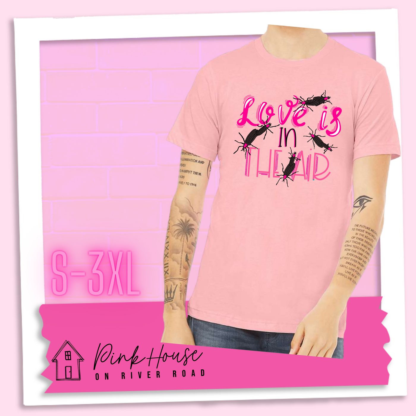 Pink Tee with Graphic. Graphic says " Love Is in the Air". "Love Is" is a hot pink cursive font with white highlights and hot pink accent lines underneath is the word "In" Is it in a black font with a hot pink highlight. on the bottom is "The Air" in Light pink with light pink accent lines. There are also black flying bugs with hot pink spots behind their heads