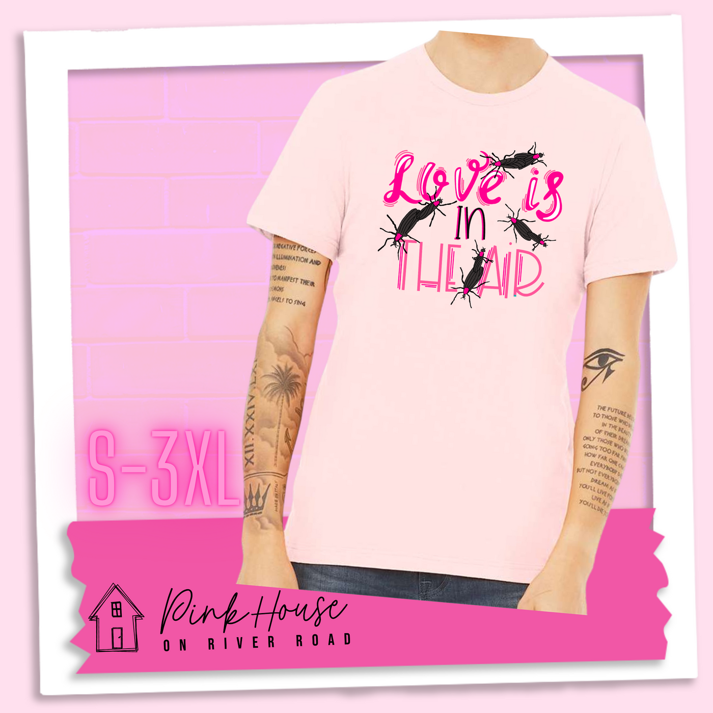 Soft PInk Tee with Graphic. Graphic says " Love Is in the Air". "Love Is" is a hot pink cursive font with white highlights and hot pink accent lines underneath is the word "In" Is it in a black font with a hot pink highlight. on the bottom is "The Air" in Light pink with light pink accent lines. There are also black flying bugs with hot pink spots behind their heads