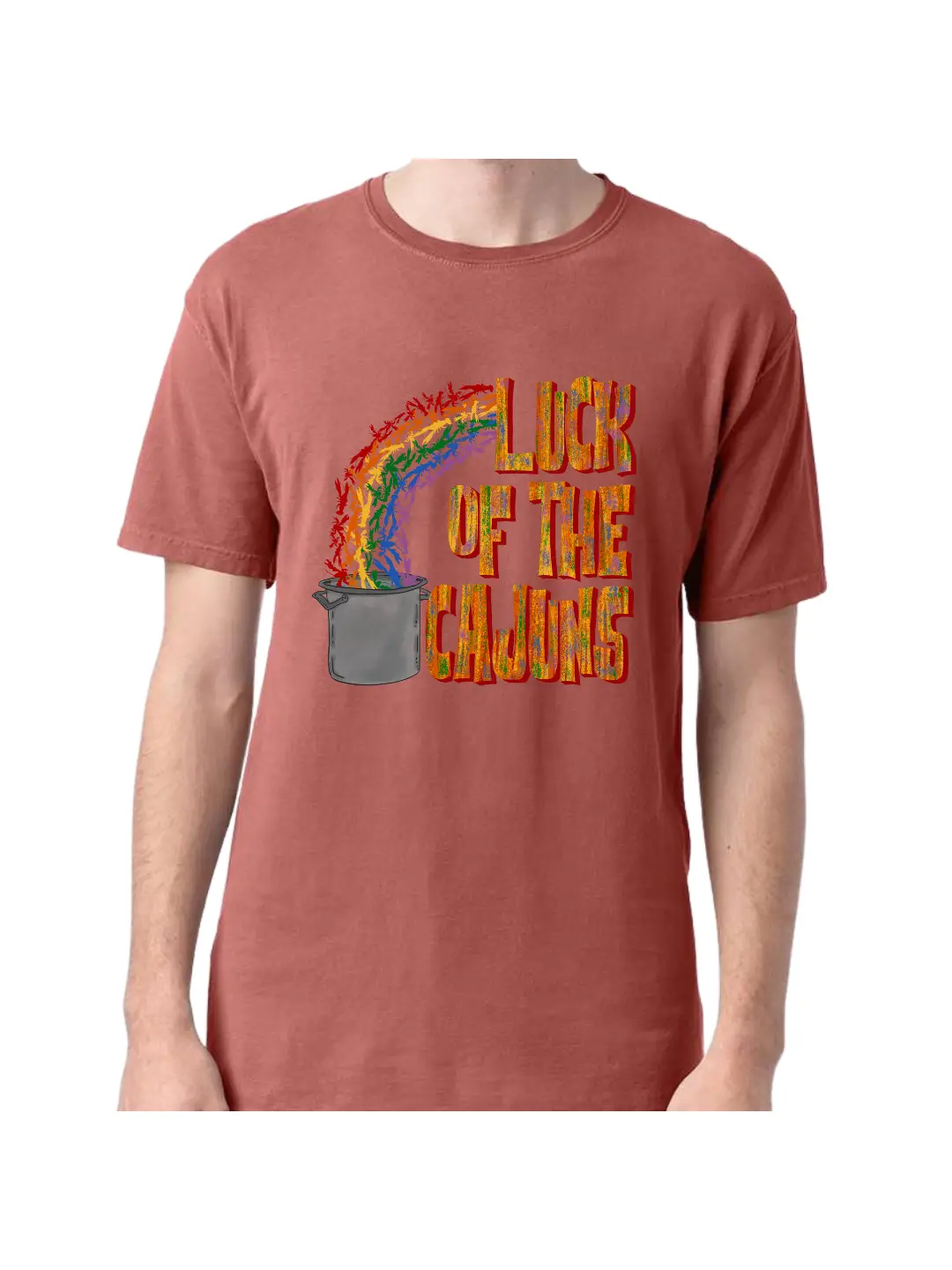 A Nantucket Red tee with a graphic. Graphic has the words Luck of the Cajuns on the right the words are in a block font with a muted rainbow. To the left there is a rainbow of crawfish ending in a large boiling pot.