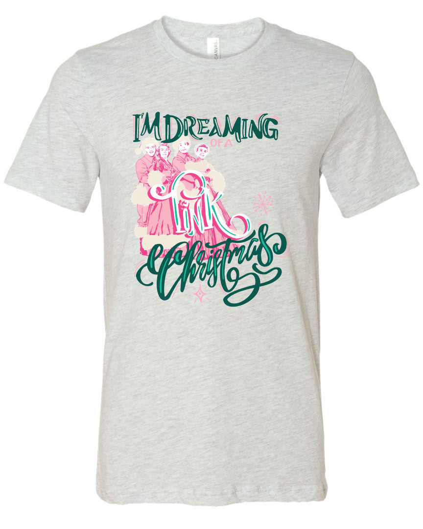 Ash Shirt with the words Im Dreaming in a green whimsical font underneath there is the wors of a in a pink color there is a graphic of two couples in vintage winter clothing and the word Pink over the couple and the word Christmas at the bottom in the same green font as the words im dreaming