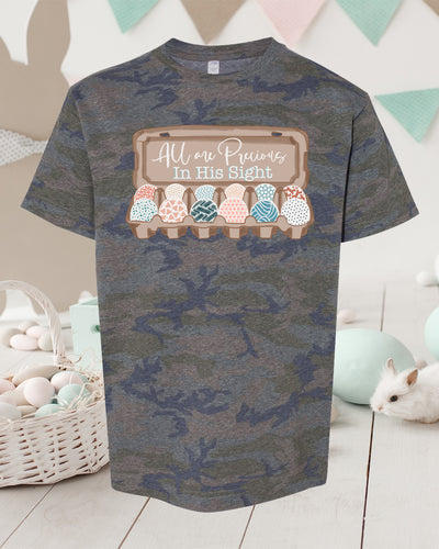 Heather Camo Shirt. Graphic is a carton of Easter eggs all with a different patterned designed and on the lid of the open carton read All are precious in his sight.